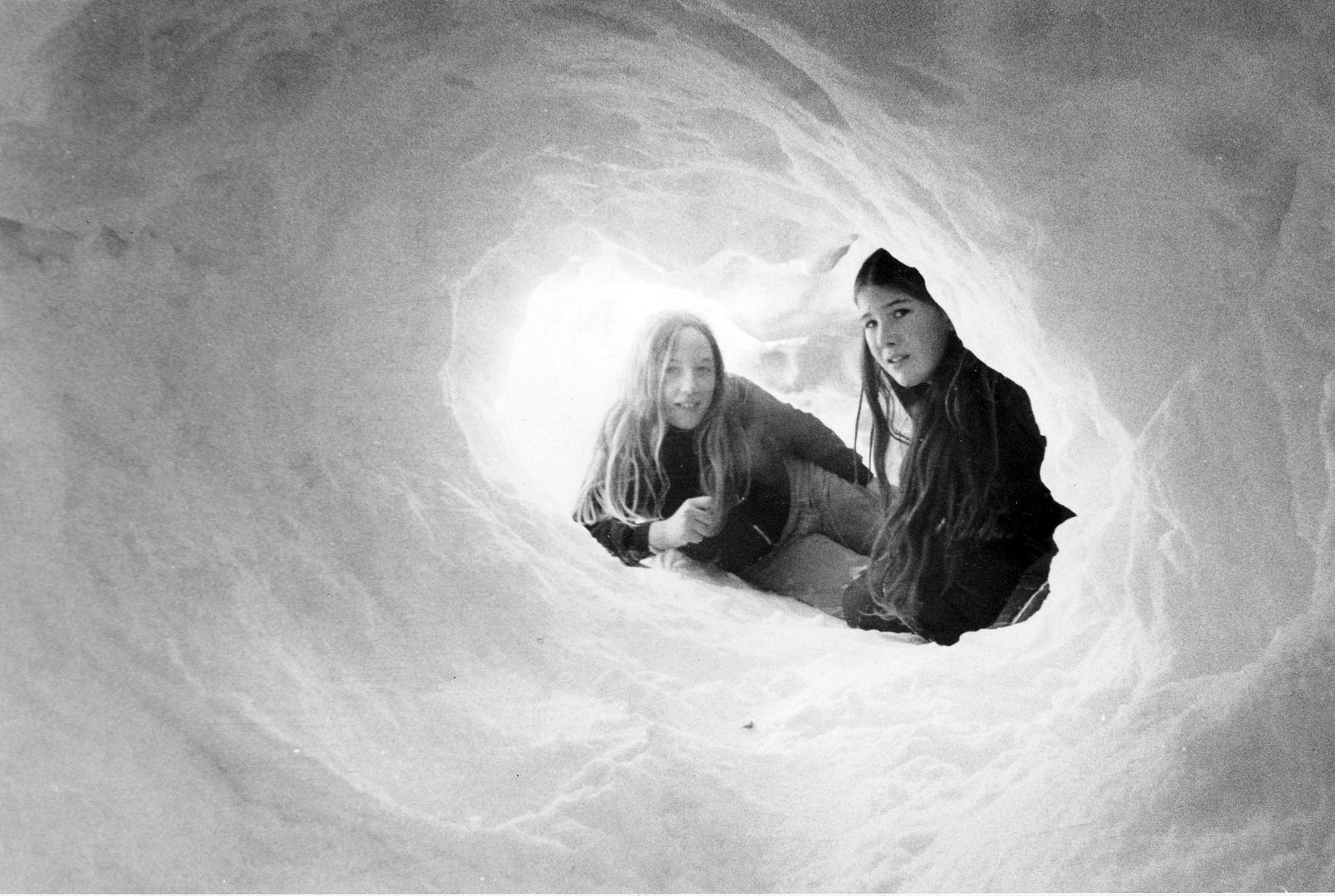 Holly Rothschild and Lisa Stastney, both 12, tunnel through the snow on Jan. 13, 1975. The girls lived near 116th and Dodge Streets.